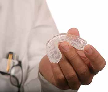 Dr. Ann Kelley at Kingsgate Dental advises how to prevent dental injuries with a custom mouth guard from Kirkland, WA